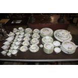 A Royal Doulton "Glamis Thistle" decorated tea / dinner service comprising dinner plates, side