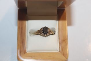 A Hallmarked 9ct gold smoky topaz ring with Celtic