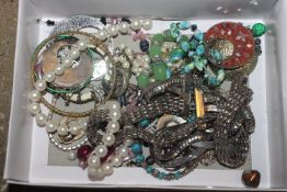 A box of costume jewellery to include dress rings,