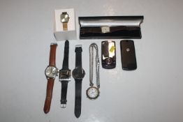 Two mobile phones and various wrist watches
