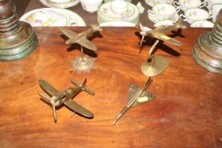 Four vintage brass models of aircraft including Co