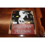 A WWII Auxiliary Fireman plaque mounted on board w