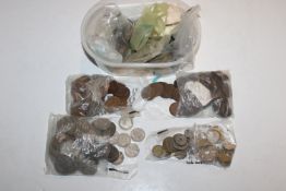 A plastic tub and contents of various coinage