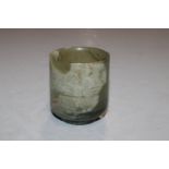 A jade coloured polished stone cup