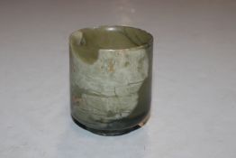 A jade coloured polished stone cup