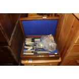 An oak cased canteen of plated cutlery and various