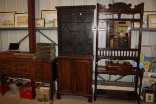 A Regency mahogany astragal glazed bookcase on cup