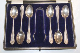 A cased set of six silver teaspoons and matching s