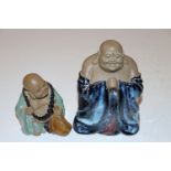 A Chinese flambé glazed standing Buddha and anothe