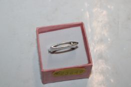 A Sterling silver and diamond Navette faced ring,