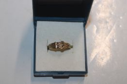 A Hallmarked vintage 9ct gold buckle ring, ring si