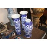 A Chinese blue and white garniture of vases compri