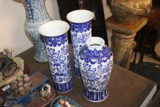 A Chinese blue and white garniture of vases compri