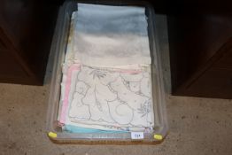 A box of various table napery and other textiles