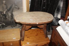 A rustic pine side table
