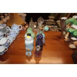 A collection of various scent bottles one having s