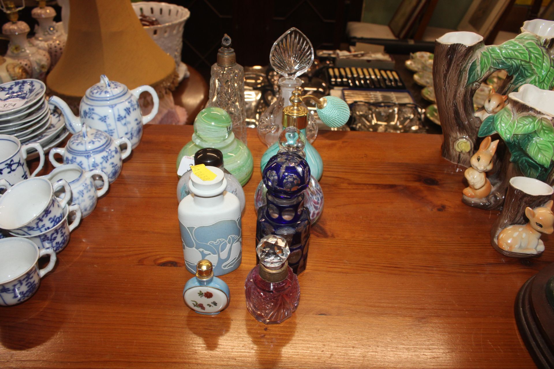 A collection of various scent bottles one having s