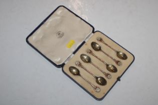 A cased set of six silver and enamel decorated cof