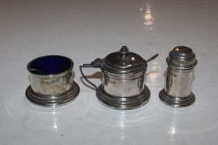 A silver three piece cruet set