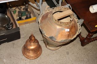 A large ornate copper lamp