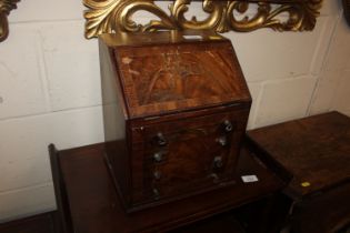 A miniature mahogany bureau