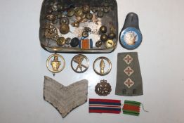 A tin on military badges and buttons