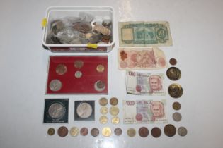 A box of various coinage and bank notes