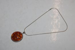 A large Hallmarked Sterling silver and amber penda