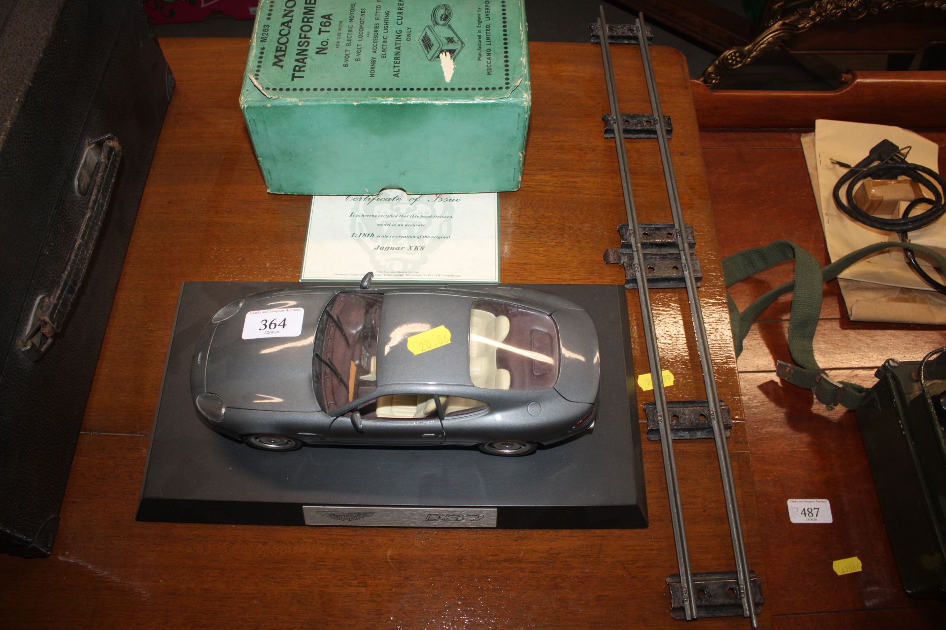 A die-cast model of an Aston Martin DB7 and a Mecc