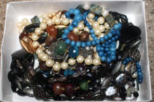 A box of costume jewellery to include bead necklac