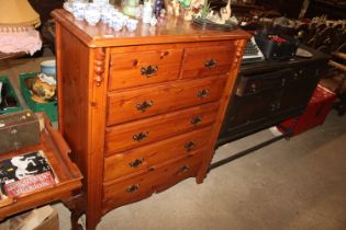 A modern pine chest fitted two short over four lon