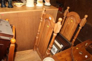 A pair of oak dining chairs