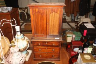 A mahogany apprentice piece linen press