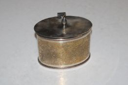 An oval silver plate on copper box and cover