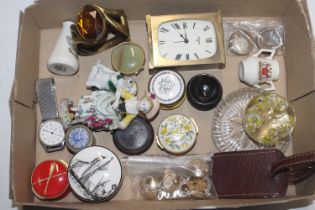 A box containing military related badges and butto