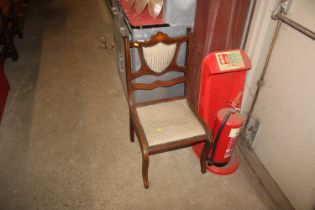 An Edwardian inlaid nursing chair