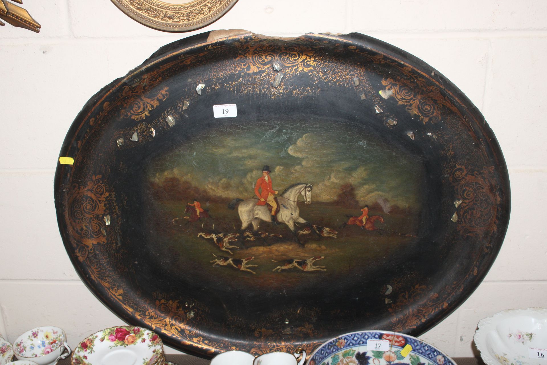 A Victorian papier mâché tea tray decorated with a