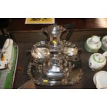 A plated four piece tea set and matching tray