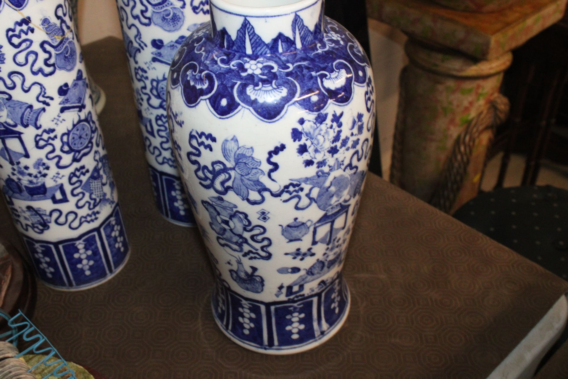 A Chinese blue and white garniture of vases compri - Image 3 of 13
