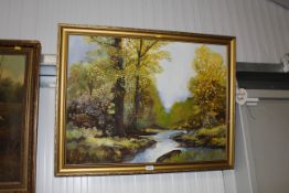 A gilt framed oil study of a river scene