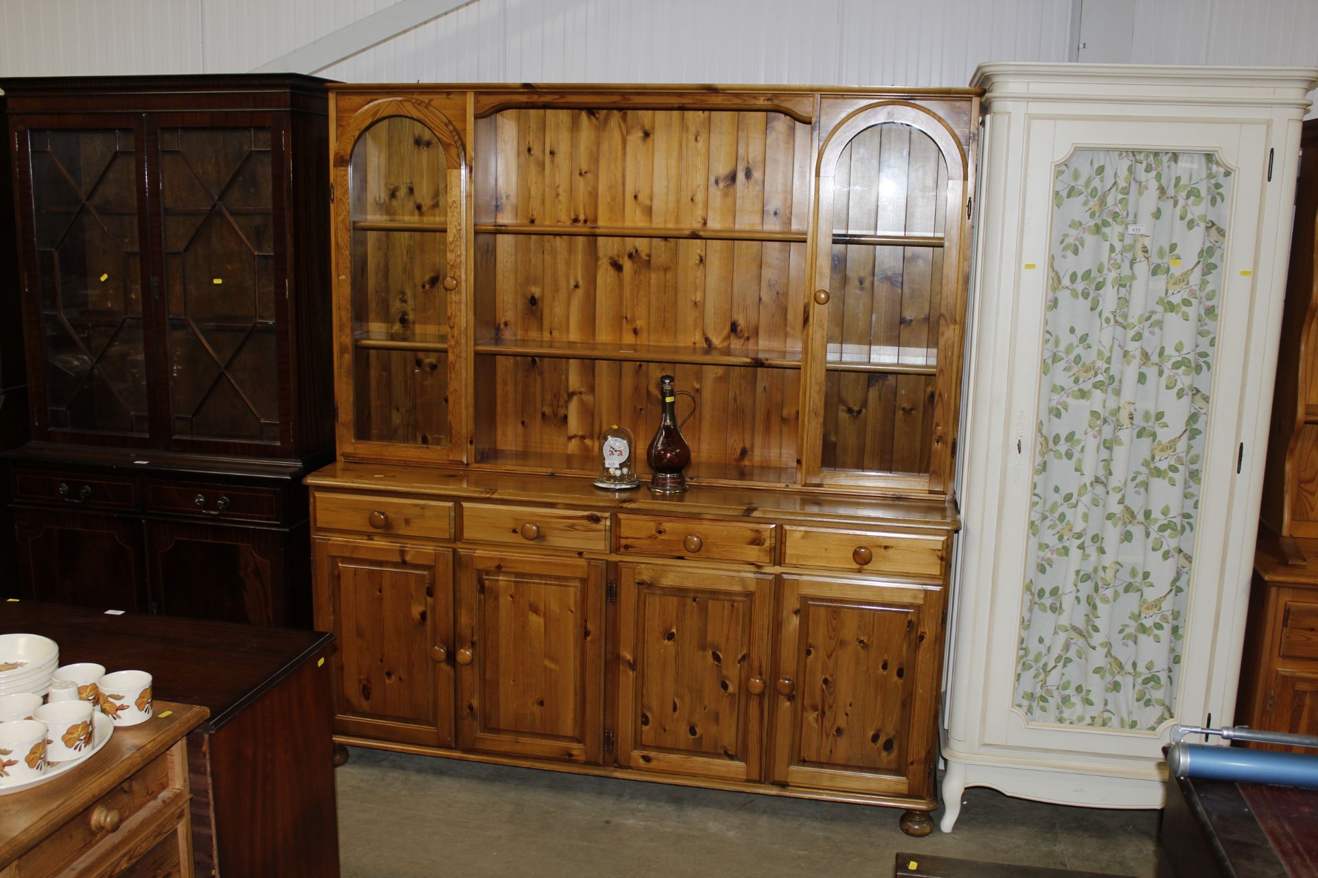 A modern pine and glazed dresser