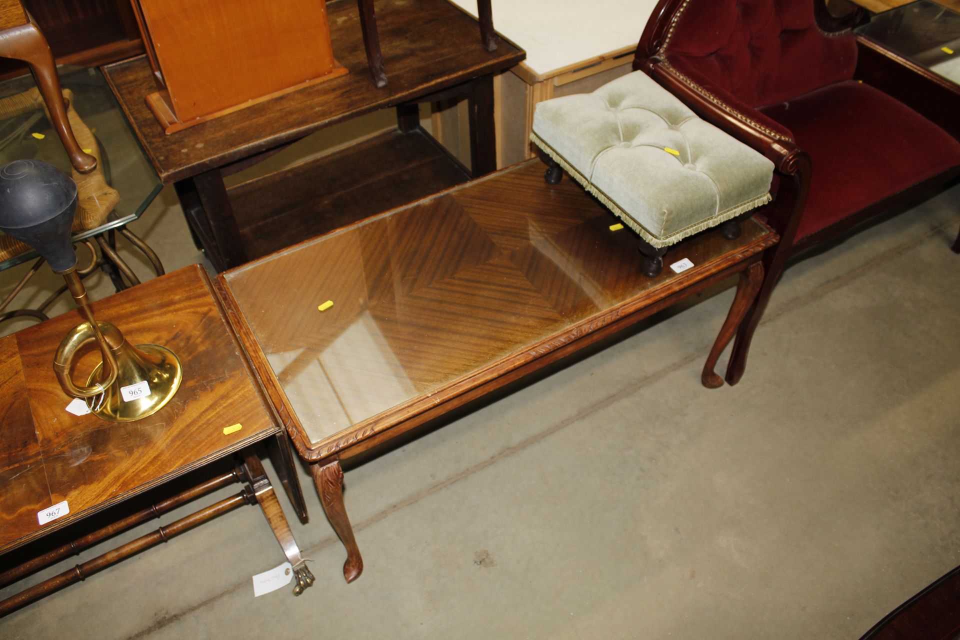 A coffee table and a button down upholstered stool