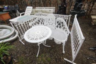 A painted aluminium circular table, a similar thr