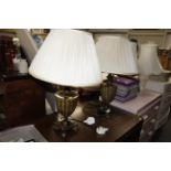 A pair of decorative metal table lamps and shades