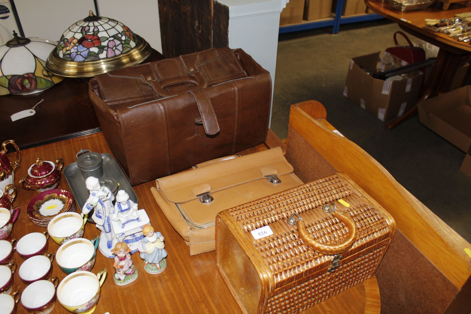 A wicker basket and two bags