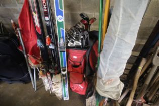 A vintage golf bag and contents of clubs including