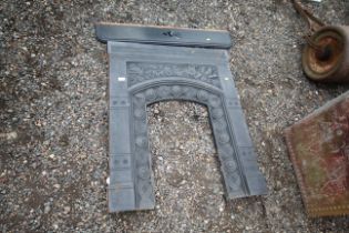 A Victorian cast iron fire surround with mantel pi