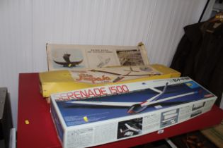 Two model gliders and a model boat (unknown if com