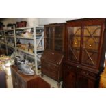 An oak and glazed bureau bookcase