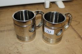 Two mugs in the form of pistons (137) (138)